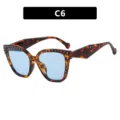 Stylish tortoiseshell cat-eye glasses featuring light blue lenses and decorative silver rivets - Rivet Style (C6) / Blue Lens / Tortoiseshell Pattern