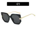 Gafas de sol oversize irregulares negro y oro para mujer, color C1 - Lente gris / Negro Brillante (C1)