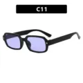 Gafas de sol rectangulares negras con lentes moradas y detalles en forma de estrella. - Negro Brillante / Lente Violeta