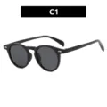 Retro fashion round black eyeglass frame with silver rivet details for women C1 - Glossy Black Frame Gray Lens (C1)