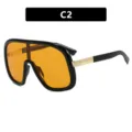 Occhiali da sole shield oversize con montatura nera e lenti arancioni - Design di tendenza. - Nero Lucido Lenti Arancioni