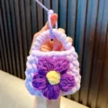 Hand-knitted lavender mini coin purse with a large purple flower charm for keychain use - Purple