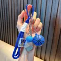 Blue sports themed keychain featuring mini basketball and golf club charms for bags - Blue