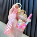 Pink bubble tea cup liquid quicksand keychain with colorful beans and cute wrist strap - Pink