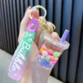 Cute bubble tea liquid quicksand keychain with colorful beads and a stylish purple strap - Purple