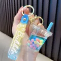 Bubble tea cup liquid keychain with blue fluid and colorful beads on a blue strap - Blue