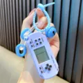 Retro purple miniature Tetris game console keychain with blue bell accessory - Blue