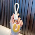 White and yellow leather letter U keychain with woven strap for bag - Letter U
