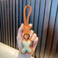 Handcrafted PU leather letter X keychain with orange rope loop for bag charms - Letter X
