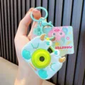 Cute light blue cartoon monster projection camera keychain featuring durable silicone casing - Monster Camera / Green