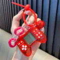Retro mini Tetris game console keychain in transparent red with controller design - Transparent Red