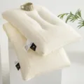 Two stacked cream latex pillows featuring elegant embroidery and silk fabric labels - Butterfly Design / 1 Piece / Off White