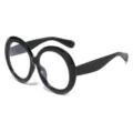 Occhiali da sole tondi oversize retrò con montatura nera spessa per un look vintage - Nero Lucido Lente Trasparente