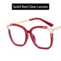Modern red and gold cat-eye glasses with hollow design and clear lenses - Anti-Blue Light Plain Lens / Solid Red