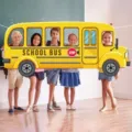 Yellow school bus photo booth backdrop for back-to-school party decorations - 180x83cm / Yellow