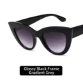 Retro cat eye sunglasses with a glossy black frame and gradient grey lenses. - Bright Black Frame Gradient Grey