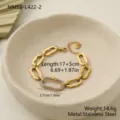 Vue détaillée d'un bracelet en acier inoxydable doré avec un maillon serti de cristaux. - Bracelet Doré (NMSB-L422-2) / Or 18 carats / 17+5cm