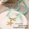 Detailansicht der minzgrünen Perlenkette mit goldenen Seesternen und OT-Verschluss - 18K-Gold / Minzgrün Mit Goldenem Seestern (NMSN-M734-2)