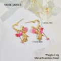 Detail view of stainless steel heart earrings with floral charms and hand pendants. - Rose Beaded Hamsa Hand Earrings (NMSE-M259-3) / 18K Gold