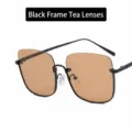 Lunettes de soleil oversize demi-cerclées avec monture noire et verres couleur thé - Unisexe / Monture Noire Verres Marrons