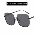 Lunettes de soleil oversize élégantes avec monture noire et verres gris pour femmes - Unisexe / Monture Noire Verres Gris