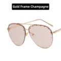 Stilvolle goldfarbene Champagner-Pilotenbrille mit dekorativen Nieten auf den Gläsern - Goldrahmen Champagner