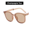 Elegantes gafas de sol plegables para mujer con montura color té champán transparente - Bisagra de Metal / Té Champaña