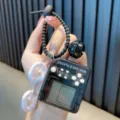 Mini black handheld Tetris game console keychain with bell and decorative plastic links - Transparent Black