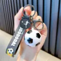 High-quality 3D soccer ball keychain charm with a black GOOOOAL wrist strap for car keys - Black