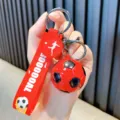 Red sports soccer ball keychain with GOOOOAL silicone strap for bags and car keys - Red