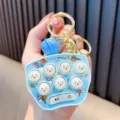 Mini electronic Whac-A-Mole game keychain in light blue with hamster silicone buttons - Blue