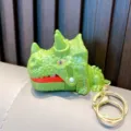 Portachiavi dinosauro verde giocattolo morde-dita con design triceratopo e anello dorato - T-Rex Verde