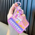 Portable purple mini piano keyboard keychain toy featuring a cute lucky cat design - Purple