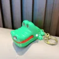 Simpatico portachiavi a forma di coccodrillo verde che morde le dita con anello - Coccodrillo Verde