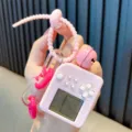 Pink mini electronic Tetris game console keychain with decorative bell and wrist strap - Pink