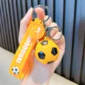 Stylish yellow soccer ball keychain with GOOOOAL strap for car keys and school bags. - Yellow