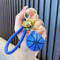 Portachiavi da basket blu in gomma con cinturino intrecciato e campanello d'oro - Blu