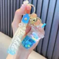 Simpatico portachiavi con bottiglia di fagioli liquidi blu e cinturino Bubble dorato - Blu