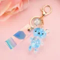 Cute blue acrylic liquid bear keychain with sparkling sequins and iridescent laser strap - Holographic Bead Short Cord Style / Blue