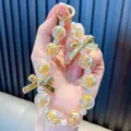 Cute crystal beaded keychain with gold bow and star charms for bags and phones. - Yellow