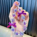 Purple beaded keychain charm with cute star pattern and bows for bags or mobile phones. - Purple