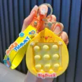 Vibrant yellow BigDuck cartoon silicone pop-it keychain with More Yummy strap for stress relief. - Yellow