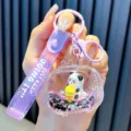 Cute purple panda liquid shaker keychain with star sequins and a glitter wrist strap - Television