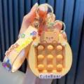 Cute orange bear pop-it keychain with silicone wrist strap for stress relief toy - Coffee