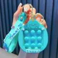 Turquoise cartoon dinosaur pop-it keychain toy with More Yummy silicone wrist strap - Blue