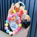 Colorful acrylic heart beaded keychain with black heart charm and beads - Black