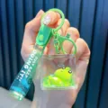 Vibrant green frog liquid filled keychain charm with wrist strap for bags and keys - Lying Style / Green