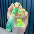 Adorable green frog liquid glitter keychain variant featuring a green logo strap - Gazing / Green