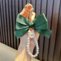 Handmade dark green ribbon bow keychain featuring elegant white pearls and a gold charm - Dark Green