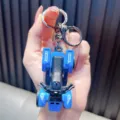 Premium detailed blue beach motorcycle ATV keychain held by hand for size reference. - Blue